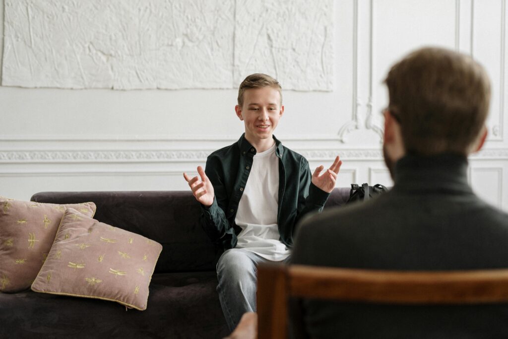 People engaged in supportive group therapy during an outpatient counseling session