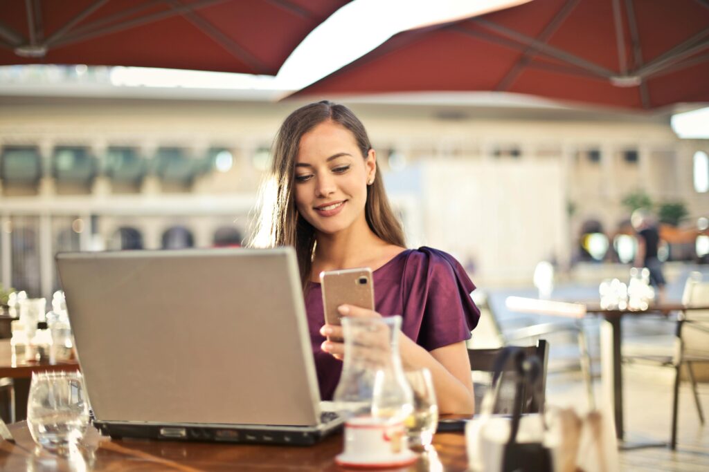 A smiling woman on a video call, representing personalized and approachable outpatient care