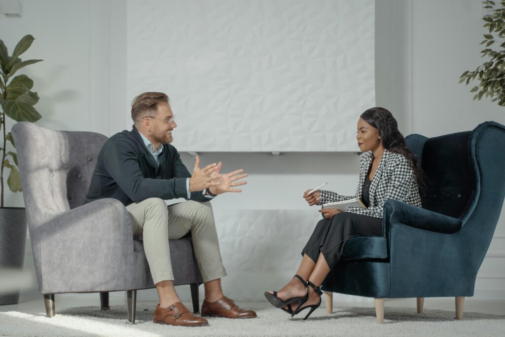 A therapist and client in a collaborative coaching session focused on emotional growth and life skills