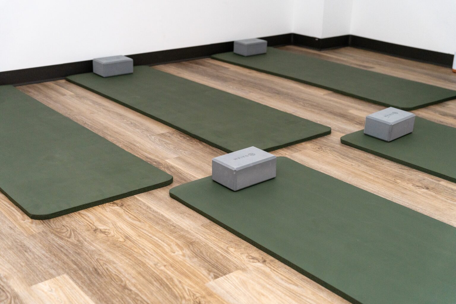 Yoga mats and blocks arranged in a serene indoor space for meditation and recovery at Altura Recovery's Intensive Outpatient Program.